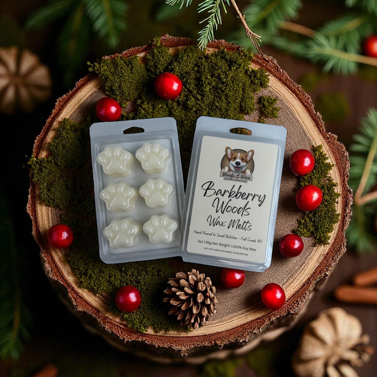 Wax melts packaging with paw prints on a wooden surface with berries and pinecones.