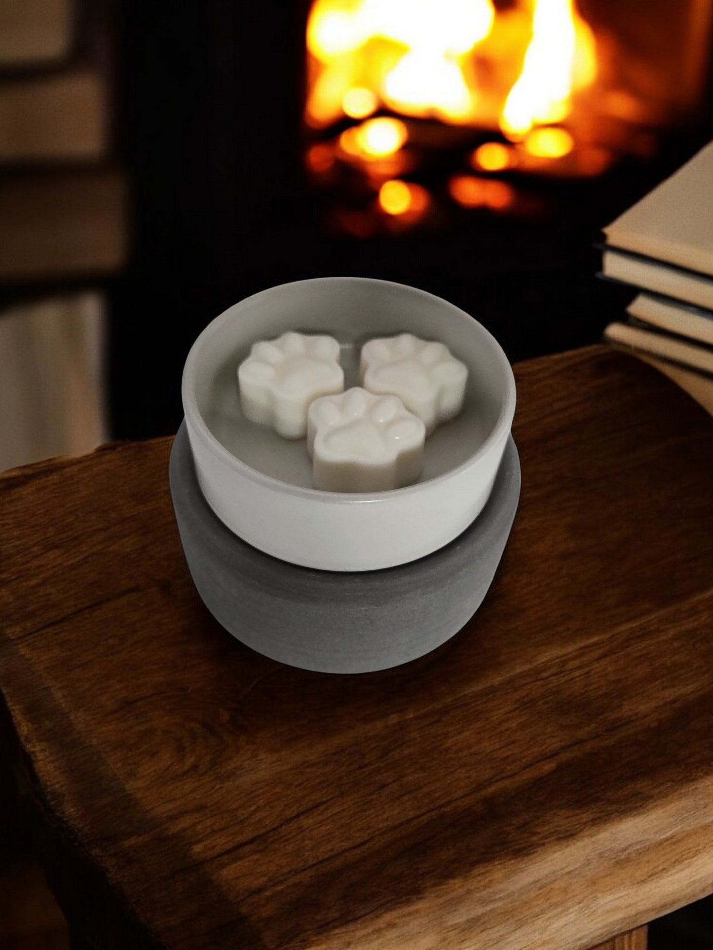 Melts in a warmer on a wooden end table in front of a fireplace