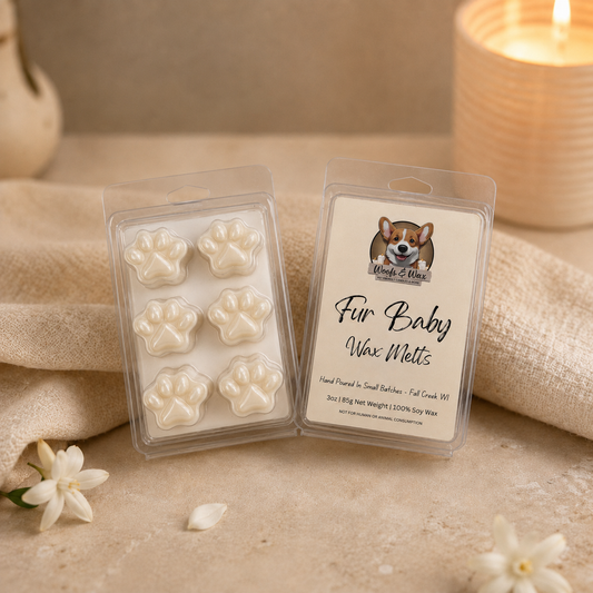 Wax melts with the label "Fur Baby" and image of a dog on a counter with a towel and candle.