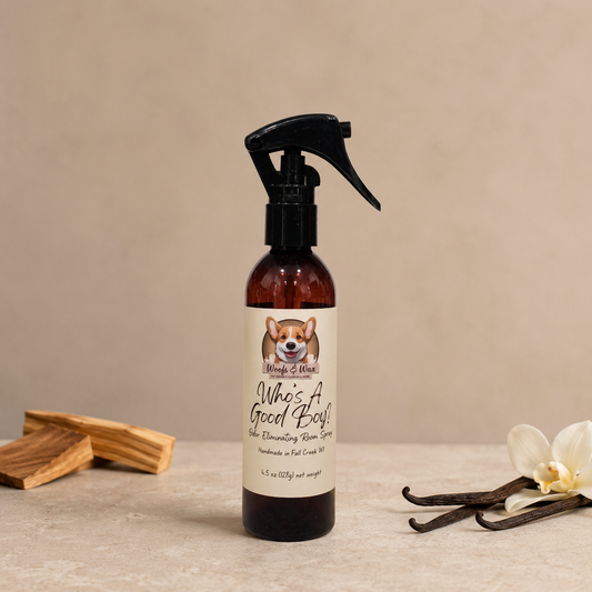 Room spray bottle with a label on a neutral background with sandalwood and vanilla.