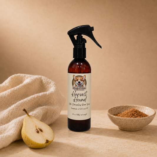 Brown spray bottle with a label featuring a dog, next to a pear and a bowl of brown powder on a beige background.