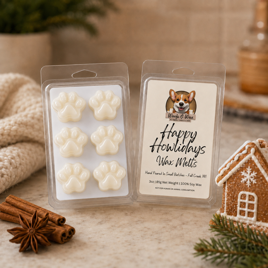 Wax melts in packaging with a 'Happy Howlidays' label, surrounded by holiday decor on a wooden surface.