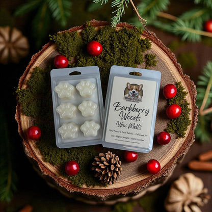 Wax melts packaging with paw prints on a wooden surface with berries and pinecones.
