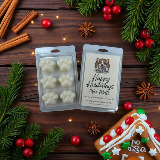 Happy Howlidays wax melts packaging with Christmas decorations on a wooden surface