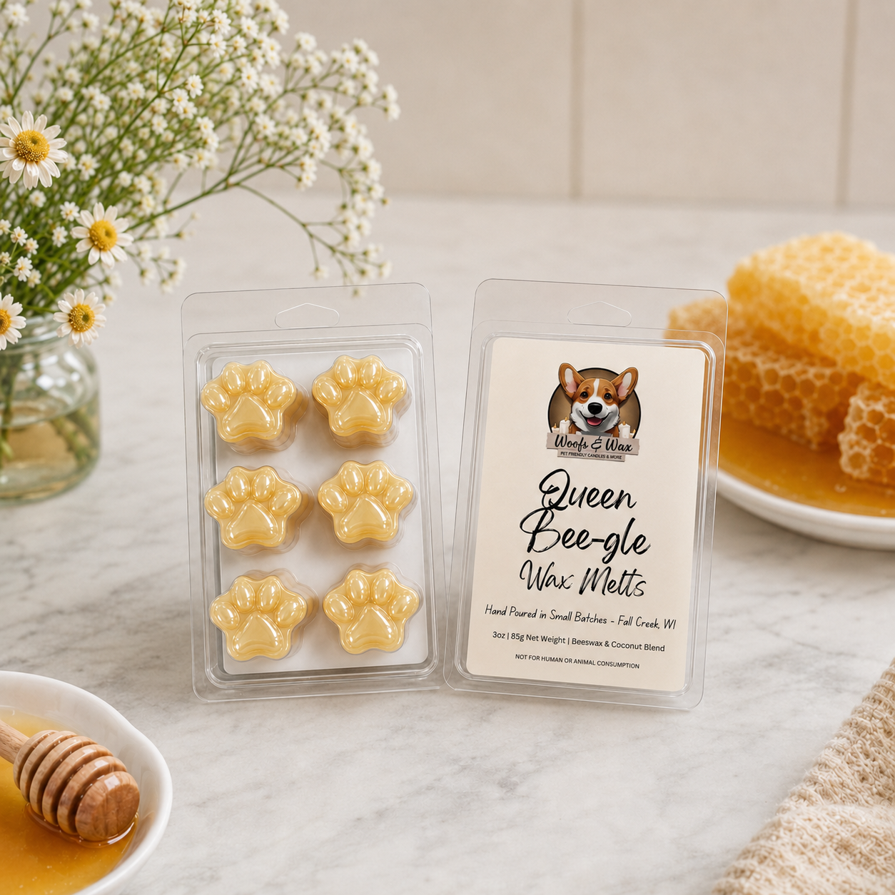 Packaged wax melts with paw design on a table with flowers and honeycomb in the background