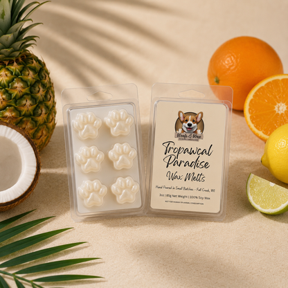 Tropical Paradise wax melts with paw prints, surrounded by pineapple, orange, lemon, and coconut on a sandy background.